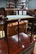 An Edwardian mahogany 'tub' dressing stool, with padded seat and string inlay.