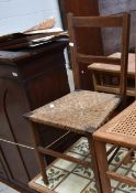 An Edwardian inlaid mahogany rush seated bedroom chair