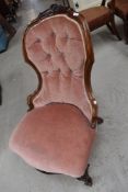 A Victorian easy chair having mahogany knurl frame and dralon upholstery