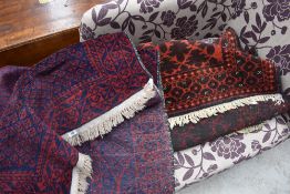 A north west Persian prayer rug and a Pakistani rug of traditional design.