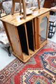 A modern pine HiFi cabinet with revolving CD storage