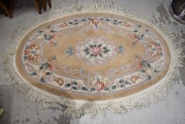 A modern Chinese rug, oval, approx. 130 x 80cm