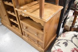 A modern pine set of bedside or similar drawers