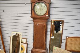 An 18th Century oak longcase clock having 8 day movement and interesting painted circular dial,
