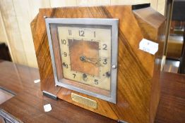 An early 20th Century mantel clock having presentation engraving to label , Tom Kelly, Rathmell