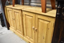 A pair of modern pine cabinets