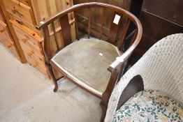 An early 20th Century stained frame salon armchair
