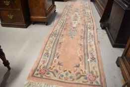 A Chinese style carpet runner, approx. 300 x 72cm