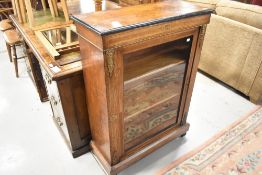 A 19th Century walnut pier style cabinet, with ormolu and inlay detailing
