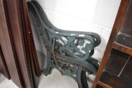 A pair of traditional metal bench ends