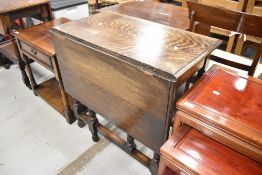 A mid 20th Century dark oak twist gateleg dining table, smaller size