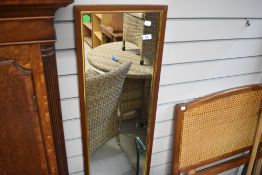 A vintage full length wall mirror and single bergere headboard