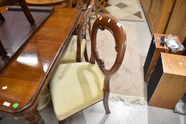 A set of four Victorian mahogany balloon back dining chairs