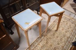 A pair of vintage kitchen stools