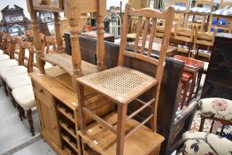 An Edwardian cane seated bedroom chair, historical signs of worm