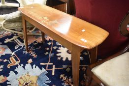 A vintage console table with lift top, in the Ercol style