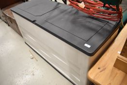 A plastic storage box, suitable for garden or similar