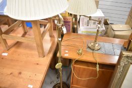 Two modern brushed brass lamps, standard and table style with adjustable necks