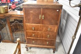 An early 20th Century tallboy cabinet