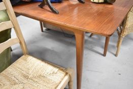 A vintage teak extending dining table by McIntosh, some staining top top but sound in the frame