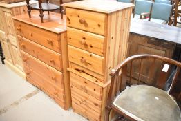 A pair of modern bedside chests of drawers