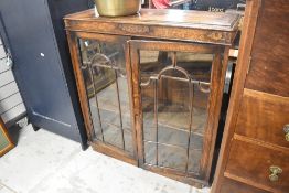 An early 20th Century oak low bookcase, width approx. 91cm