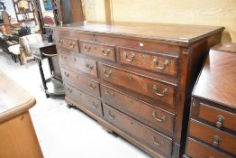 A period oak mule chest having lift top , double dummy drawers to top two tiers and four drawers