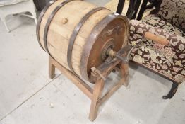An antique butter churn on stand, named E Richardson, Kendal