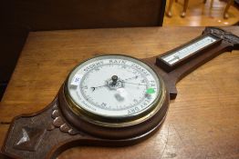 An early 20th Century oak cased aneroid barometer