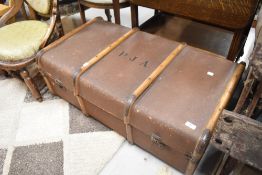 A vintage travel trunk, bearing monogram PJA
