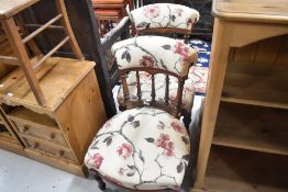 A pair of Edwardian mahogany and inlaid salon nursing chairs