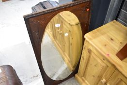 A Victorian mahogany mirrored panel with wall hangings
