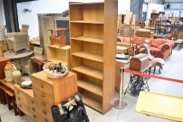 A traditional golden oak library or commercial bookcase having deep shelves