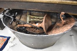 A traditional tin bath, modern companion set and reproduction sun dial
