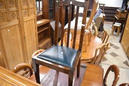 An early 20th Century stained frame dining chair with vinyl drop in seat