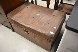 A traditional tin travel trunk, bearing 'Kendal' label to top