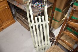 A traditional painted wooden toboggan (shop early for Christmas!)
