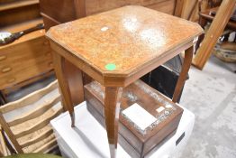 A reproduction occasional table in the Continental style