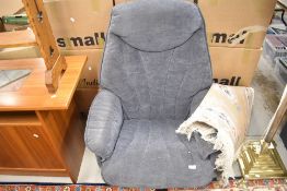 A modern easy chair, in the vintage style with suedette upholstery