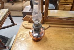 A Victorian glass oil lamp reservoir and chimney