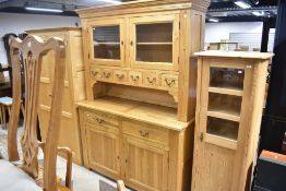 A good quality modern dresser havimg glazed section, centre spice drawers, and lower drawer and