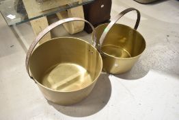 Two antique brass pans