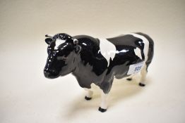A Beswick figure study of a fresian bull CH Cordington Hilt Bar