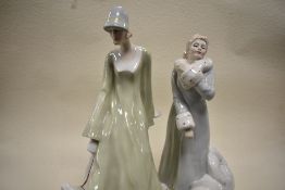 A pair of Royal Doulton figurines from the Reflections series by Adrian Hughes Strolling HN3073