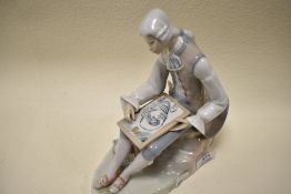 A Casades porcelain figurine of classically dressed gent painting.