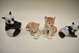 A selection of USSR Lomonosov figures including two Pandas and a pair of Lion cubs