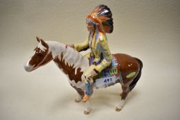 A Beswick figure of Mounted Indian on Skewbald pony 1391