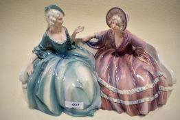 A figurine, Two ladies seated,gloss finish.