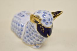 A Royal crown Derby sheep study,having silver stopper.