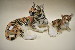 A USSR Lomonosov figure of a large tiger and cub both bearing mark to base